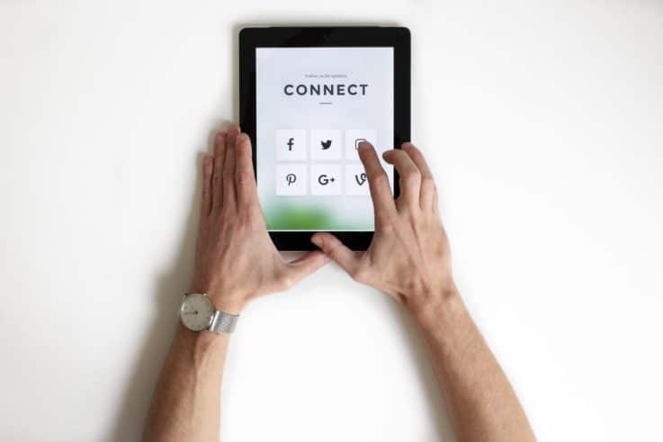 Omnichannel - Man using ipad to connect